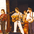 The Johnson Mountain Boys at the Sylvan Theater, Washington, DC,   July 4, 1994. L-R: Eddie Stubbs, David McLaughlin, Dudley Connell, Ira, Tom Adams.